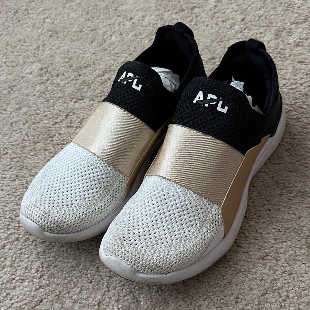 APL Slip-On Knit Sneakers in White, Black & Gold